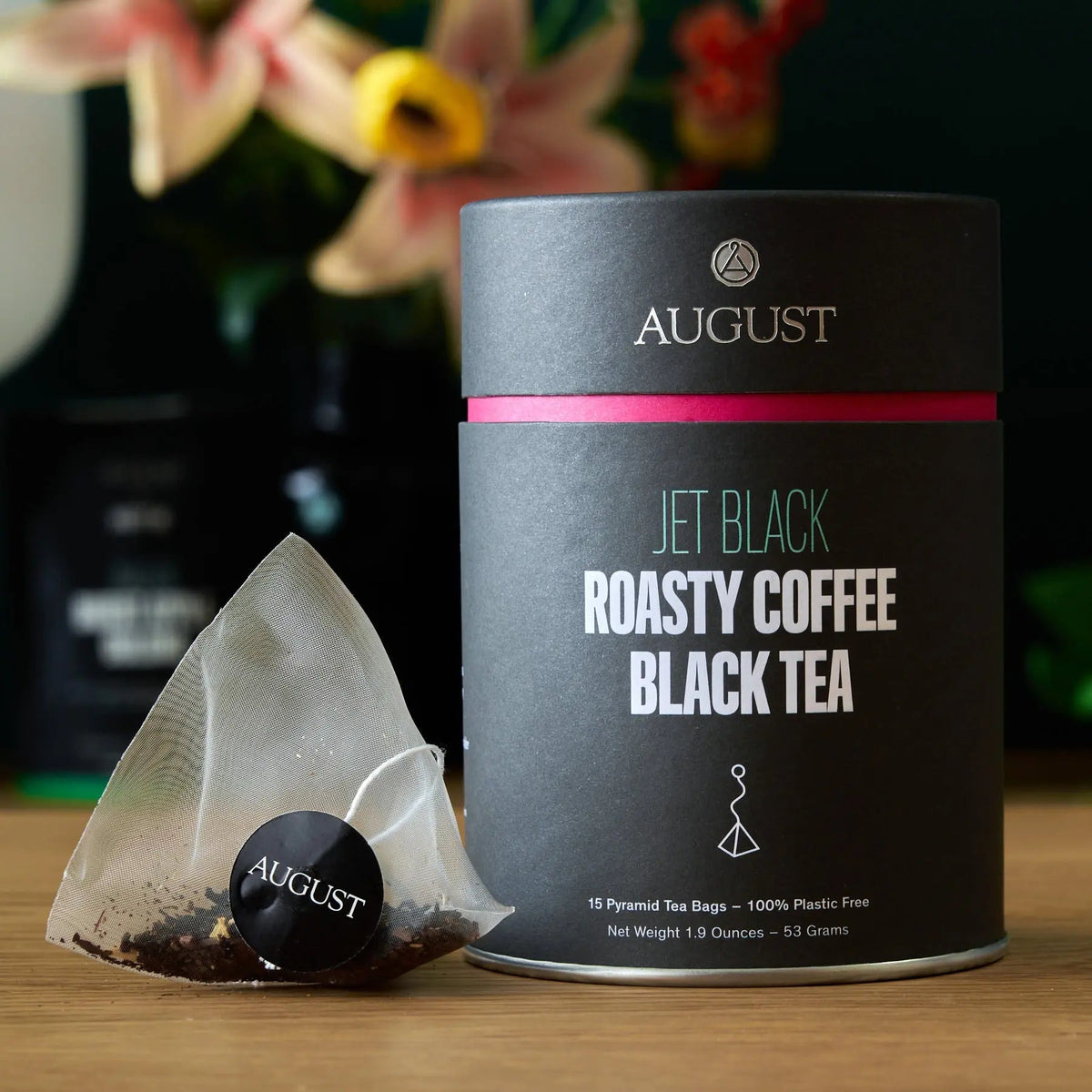 Jet Black roasty coffee black tea canister with a pyramid tea bag beside it, Da LBI Tea