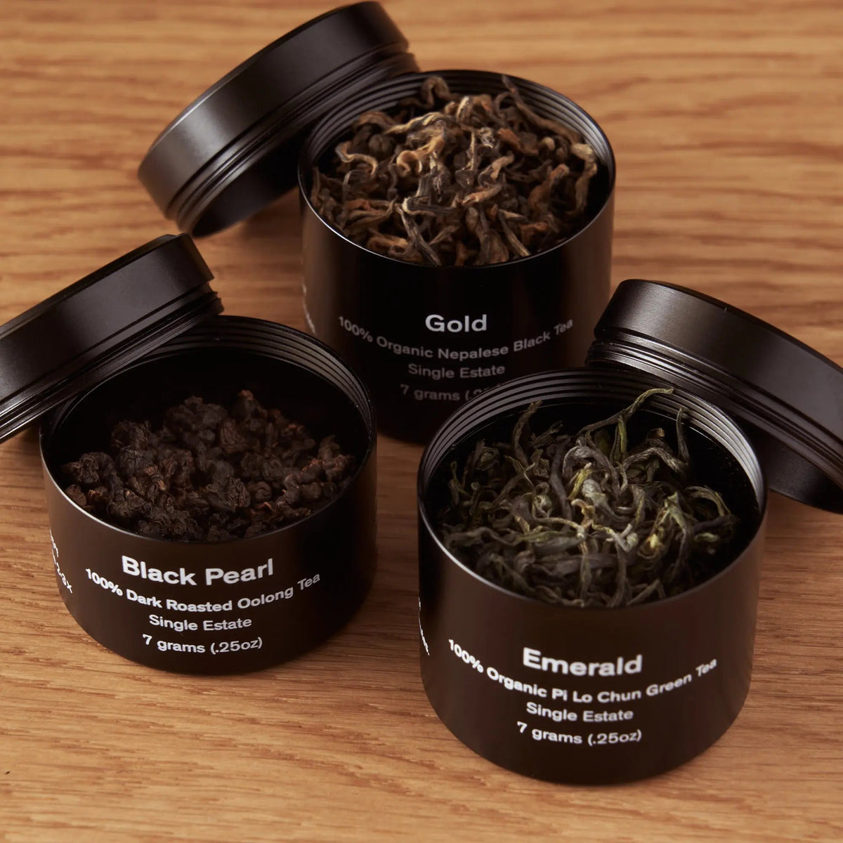 Da LBI Rare Leaves mini tin sampler of three single-origin teas, three mini tins, open with loose leaves